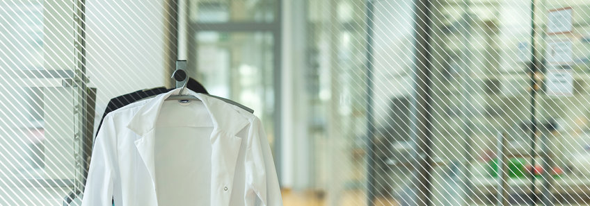lab coat hanging in office space